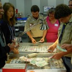 BOY SCOUTS DISCUSSING CURRENCY ONT0711