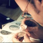 Lange examines a coin
