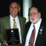Rosen receiving Clemy Award