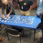 Texas Bullion Depository Security Officials Learn About Numismatic Fakes Doug Davis setting up counterfeits display