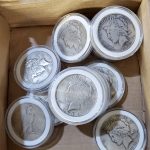 Some of the fake Peace dollars discovered among the approximately 40,000 counterfeit silver and gold coins seized on arrival in the Los Angeles area.  (Photo courtesy of Anti-Counterfeiting Educational Foundation.)